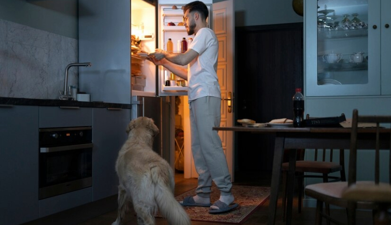 man-with-dog-in-kitchen